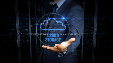 Businessman touch screen with cloud hologram