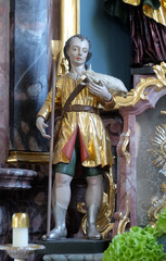 Fototapeta premium Statue of Saint on the Saint Joseph altar in the Saint Lawrence church in Denkendorf, Germany
