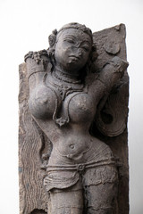 Fototapeta premium Salabhanjika, from 13th century found in Khondalite Konark, Odisha now exposed in the Indian Museum in Kolkata, West Bengal, India 