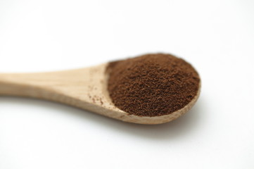 wooden spoon with coffe powder