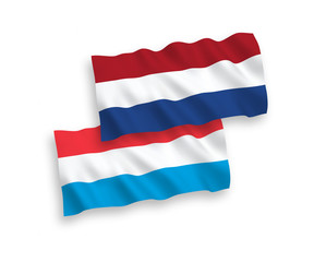 National vector fabric wave flags of Netherlands and Luxembourg isolated on white background. 1 to 2 proportion.