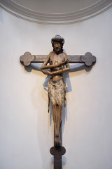 Schmerzensmannkreuz, Jesus on the cross, his arms crossed like a gesture of embrace, Neumunster Collegiate Church in Wurzburg, Germany