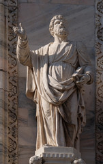 Fototapeta premium Apostle, statue on the facade of the Milan Cathedral, Duomo di Santa Maria Nascente, Milan, Lombardy, Italy