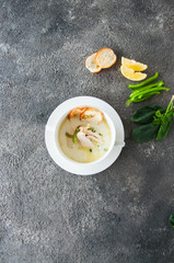 Creamy vegetable soup with chicken and croutons