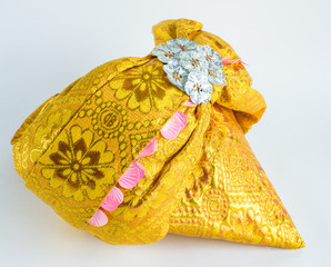 Traditional Tajik national headdress close-up on white background