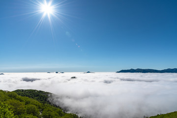 Panorama view from Unkai Terrace in summer time sunny day. Take the cable car at Tomamu Hoshino Resort, going up to see the sea of clouds. Shimukappu village, Hokkaido, Japan