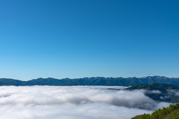 Panorama view from Unkai Terrace in summer time sunny day. Take the cable car at Tomamu Hoshino Resort, going up to see the sea of clouds. Shimukappu village, Hokkaido, Japan