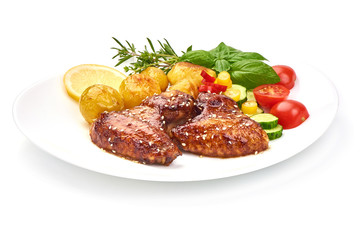 Grilled chicken wings with baked potatoes, Restaurant food, close-up, isolated on white background