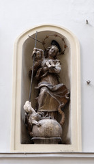 Virgin Mary with baby Jesus, statue on the house facade in Graz, Styria, Austria 