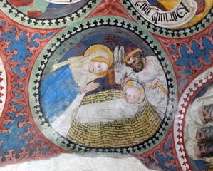 Fototapeta na wymiar Nativity Scene, fresco in the cloister, Cathedral of Santa Maria Assunta i San Cassiano in Bressanone, Italy