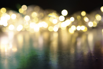 Garland of light bulbs on a black background. Place for text.