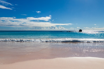 A view out to sea from the idyllic sandy beach of Horseshoe Bay on the island of Bermuda
