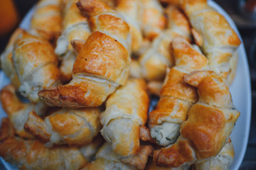 Homemade croissants stuffed with cheese.