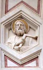 Fototapeta na wymiar Saint Thomas the Apostle, relief on the facade of Basilica of Santa Croce (Basilica of the Holy Cross) - famous Franciscan church in Florence, Italy