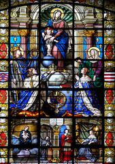 Mary and Child, King Louis IX holding the crown of thorns, King Louis XIII and his wife Anna of Austria, stained glass in the Basilica of Notre Dame des Victoires