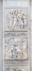 Escape of Loth by Niccolo Tribolo up and Birth of Esau and Jacob by Alfonso Lombardi down, left door of San Petronio Basilica in Bologna, Italy