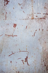 Rusty metal texture background with cracked white paint