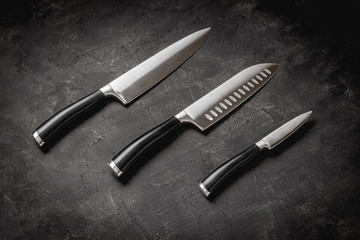 Modern Kitchen Knives Set on Stone Background. Chef's Knives Concept. - 277872420