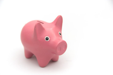 Pink piggy bank on white background
