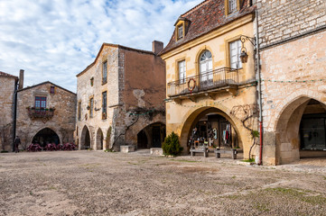 Fototapeta premium The village of Monpazier, in the Dordogne-Périgord region, France. Medieval village with arcades and typical square