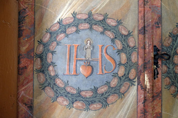 IHS sign on altar in cahedral of Assumption in Varazdin, Croatia