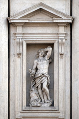 Fototapeta na wymiar Saint Sebastian on the portal of Sant Andrea della Valle Church in Rome, Italy