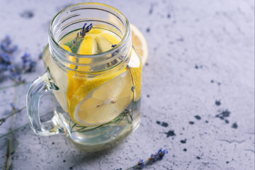 Summer refreshing drink infused water with lemon and lavender in a jar
