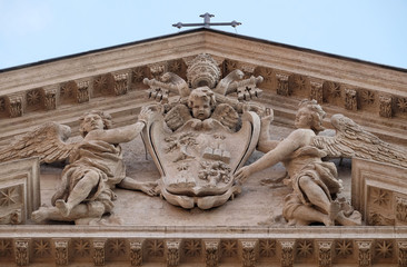 Fototapeta na wymiar Coat of arms of Pope Alexander VII Chigi on the portal of Sant Andrea della Valle Church in Rome, Italy 