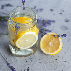 Obraz na płótnie Canvas Summer refreshing drink infused water with lemon and lavender in a jar