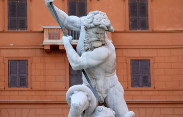 Piazza Navona, Neptune fighting with an octopus statue in the Fountain of Neptune in Rome, Italy 