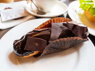 Chocolate cake on white dish
