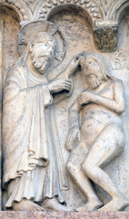 Plate with stories from Genesis: Creation Of Adam relief by Wiligelmo, Modena Cathedral, Italy 