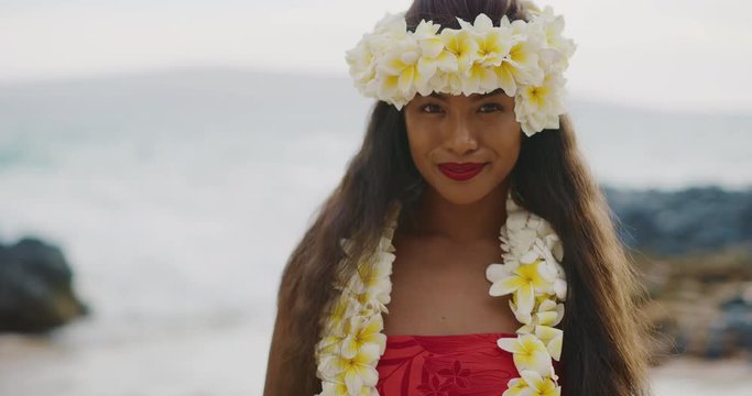 Portrait of a Hula 'Auana dancer woman wearing a plumeria haku lei
