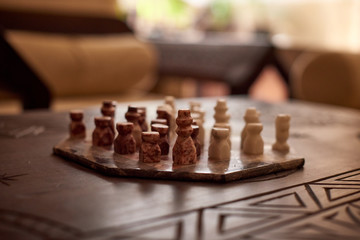 Wooden chess board and set of handmade chess figures. Riad, Medina, Marrakesh, Morrocco.