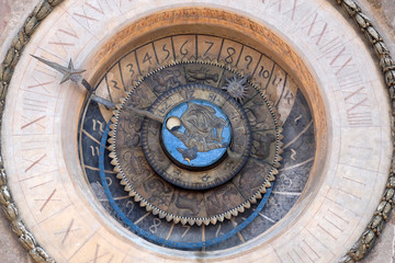 Clock tower of Palace of Reason (Palazzo della Ragione with the Torre dell'Orologio) in Mantua, Italy 