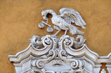 Beautiful house facade with carved stone animals in Mantua, Italy 