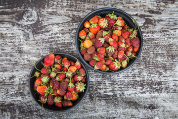 Beautiful, freshly picked garden strawberries in a bowl. Healthy vegan, ecological food in summer.