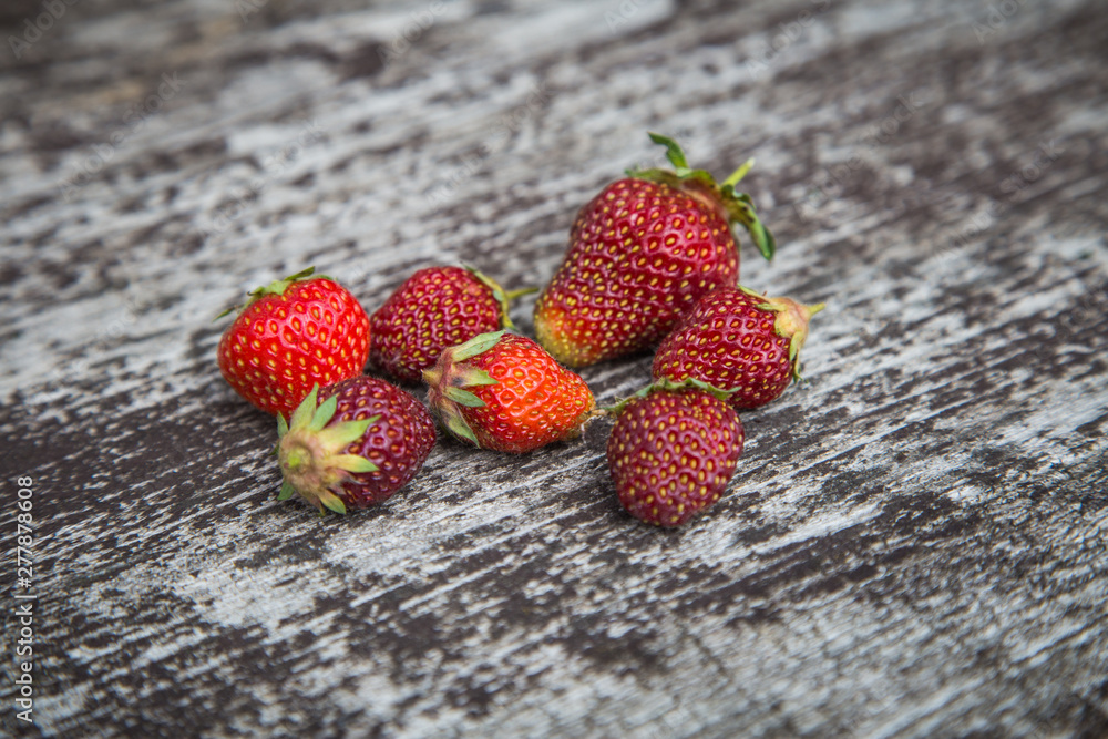 Wall mural beautiful, freshly picked garden strawberries in a bowl. healthy vegan, ecological food in summer.