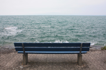 Naklejka na ściany i meble Blue bench on the lake in Switzerland.