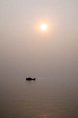 A stunning sunset looking over the holiest of rivers in India. Ganges delta in Sundarbans, West...