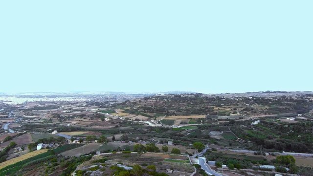 Aerial drone view of the Maltese landscape with the farmland below where potato farming accounts for 36000 metric tons of potatoes yearly, most of which is consumed locally.