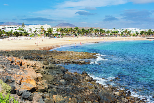 View of Playa de las Cucharas beach in Costa Teguise, Lanzarote, Spain, turquoise waters, selective focus
