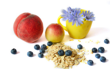 breakfast: oatmeal, peach, blueberry, chicory on a white background. Healthy food diet proper nutrition