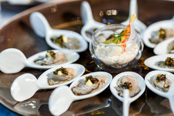 Tables in the restaurant with snacks and dishes. easy food for guests. business lunch. preparing for the Banquet. smorgasbord. mass event, coffee break. .Catering event plate service, Self-service..