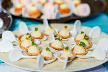 Tables in the restaurant with snacks and dishes. easy food for guests. business lunch. preparing for the Banquet. smorgasbord. mass event, coffee break. .Catering event plate service, Self-service..