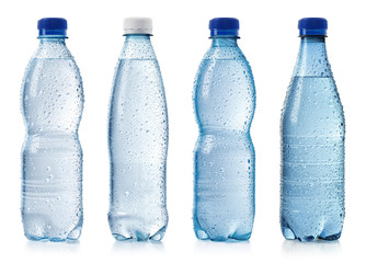 Collection of various cold bottles of water with drops - obrazy, fototapety, plakaty