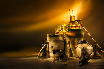 In the cellar of the winemaker bottles and barrels of alcohol