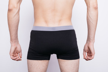 body parts: men's ass in underwear. inflated buttocks in boxer shorts. elastic muscles after...