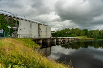 Fototapeta na wymiar Hydro electric power plant with overcast sky
