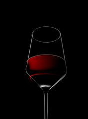 red wine in glass isolated on black